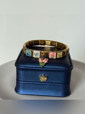 Gold-tone Italian charm bracelet with floral enamel links
